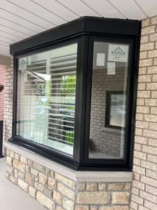 Exterior view of a bay window installed by EcoTech Windows and Doors, highlighting its stylish design and how it enhances the home's overall appearance.