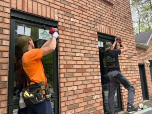 Professional installers from EcoTech Windows and Doors, ensuring proper installation and quality service for your window replacement project.