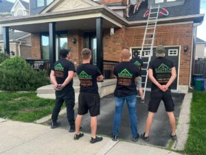Installers from EcoTech Windows and Doors working diligently at a job site, ensuring precise installation of bay windows as described in the blog.