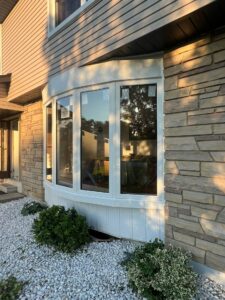 White energy-efficient window installed in a stylish modern home, enhancing natural light and maintaining a comfortable indoor temperature during summer.
