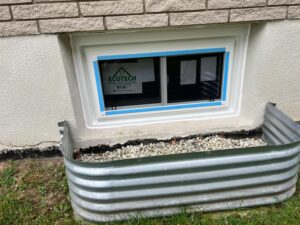 Alt text for an egress white window: A white egress casement window installed by EcoTech Windows and Doors, showcasing safety, efficiency, and modern design.