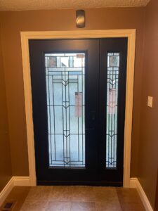 Sophisticated black fiberglass door with a sleek, modern design, showcasing its durability and stylish appearance.