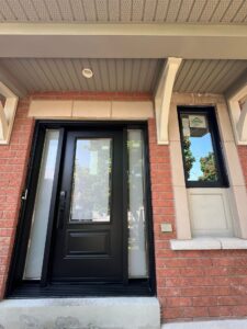 Privacy glass on a black entryway door, combining style and security while allowing natural light to enter.