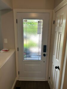 White privacy door providing a sleek and modern look while ensuring privacy and allowing natural light to enter the home.