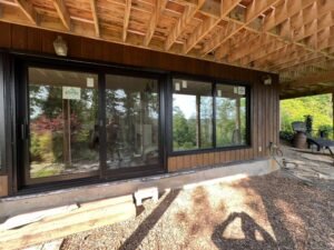 New construction home with EcoTech windows installed, with construction paper around the windows to highlight their placement and energy-efficient features.