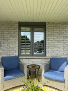 Image of a modern thermal window showing its features, including a sleek frame and multiple panes of glass. The window is designed for energy efficiency and enhanced insulation, with visible elements like Low-E coatings and triple glazing.