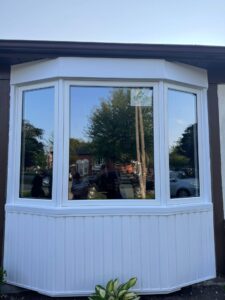 Elegant bay window in a Mississauga home, featuring energy-efficient glass and a spacious design that enhances natural light and room aesthetics.