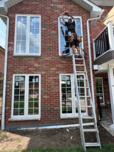 A casement window highlighting the clean lines and secure fit between the window frame and the brick exterior, allowing fresh air and natural light to flow into the home.