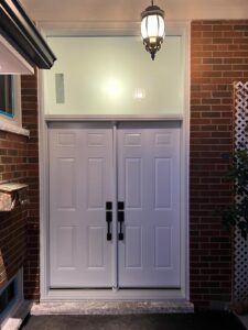 Frosted glass in a transom window above a door, enhancing privacy while allowing light to filter through.