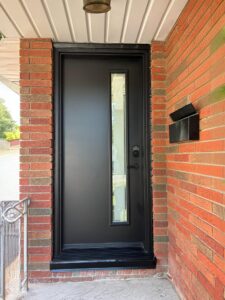 entry door by EcoTech with a contemporary design, featuring a rich wood-like finish and elegant glass panels