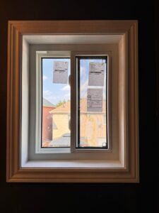 Sliding window fully closed, with both sashes neatly aligned within the frame, showcasing a sleek, modern design and a clear, unobstructed view through the glass