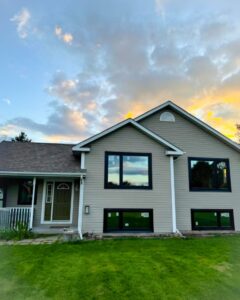 Exterior view of a home featuring triple pane windows, showcasing its energy-efficient and noise-reducing design, compliant with Energy Star standards.