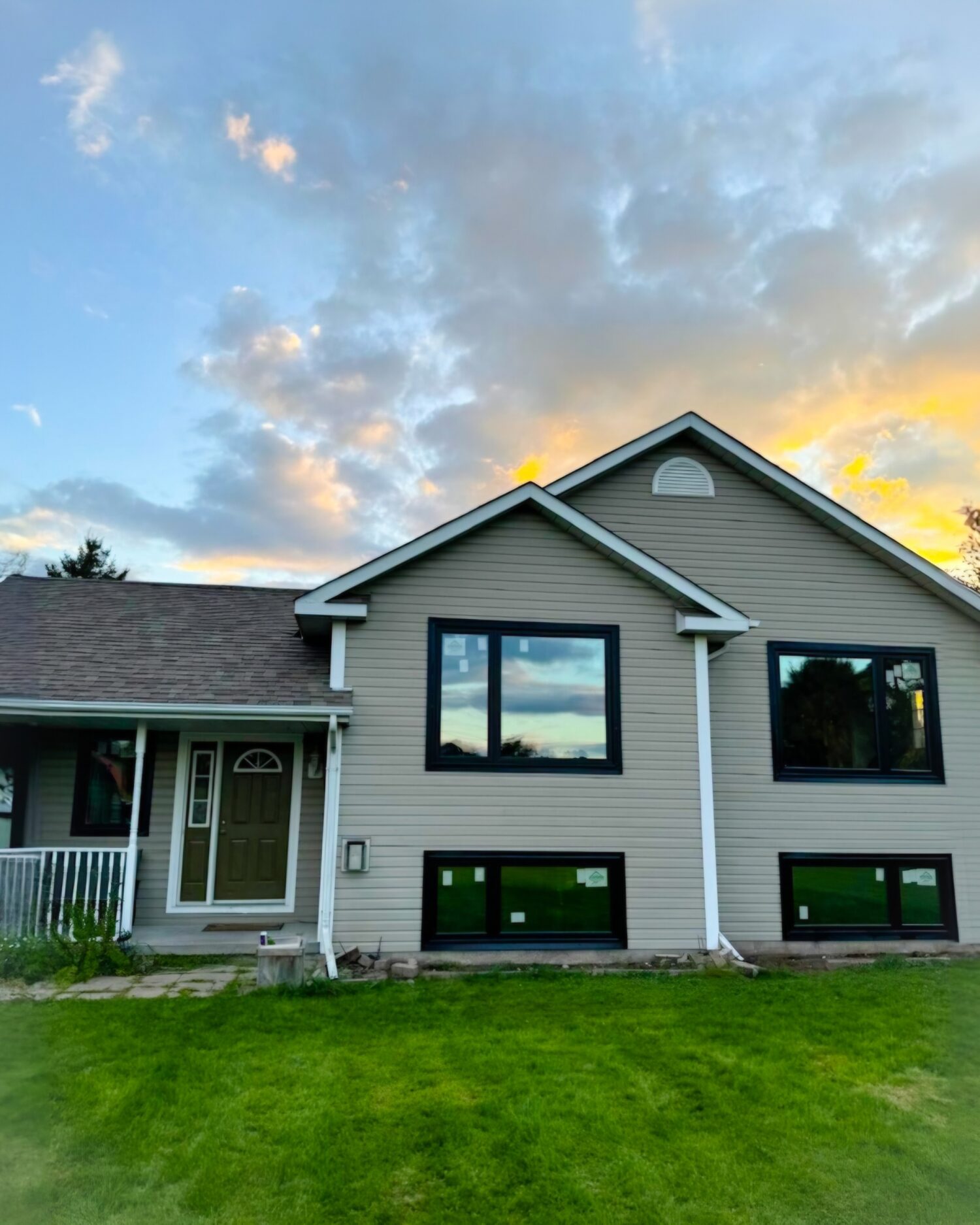 Exterior view of a home featuring triple pane windows, showcasing its energy-efficient and noise-reducing design, compliant with Energy Star standards.