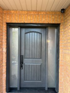 Chic black fiberglass entry door with a contemporary design, providing both strength and style for a stunning entrance.