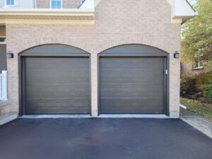 A modern garage door from EcoTech, the best window company in Etobicoke, featuring a stylish design that enhances the overall appearance of the home.