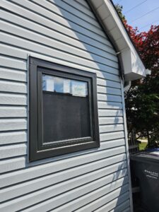 An awning window in a Toronto home, showcasing a top-hinged design that opens outward, part of a professional windows and doors installation in Toronto.