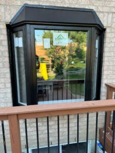 Black window frame from EcoTech Windows and Doors, showcasing a sleek, modern design with energy-efficient features.