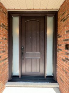 Rich brown fiberglass entry door with a smooth finish, offering durability and elegance for a welcoming entrance.