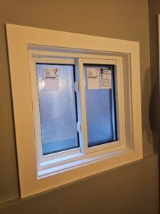 A pair of slider windows in a Toronto home, featuring two horizontal sashes that slide smoothly for easy ventilation and natural light.