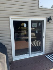 A sleek patio door installed by EcoTech, the best window company in Etobicoke, seamlessly connecting the indoor living space to the outdoor patio.